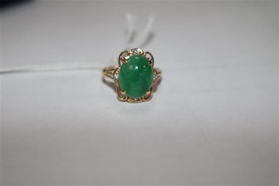 A 14ct gold jade and diamond set dress ring, size O.